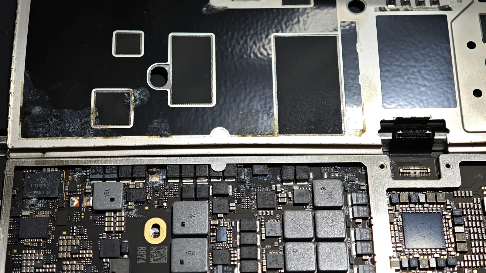 Corrosion on a MacBook Air logic board after liquid contact