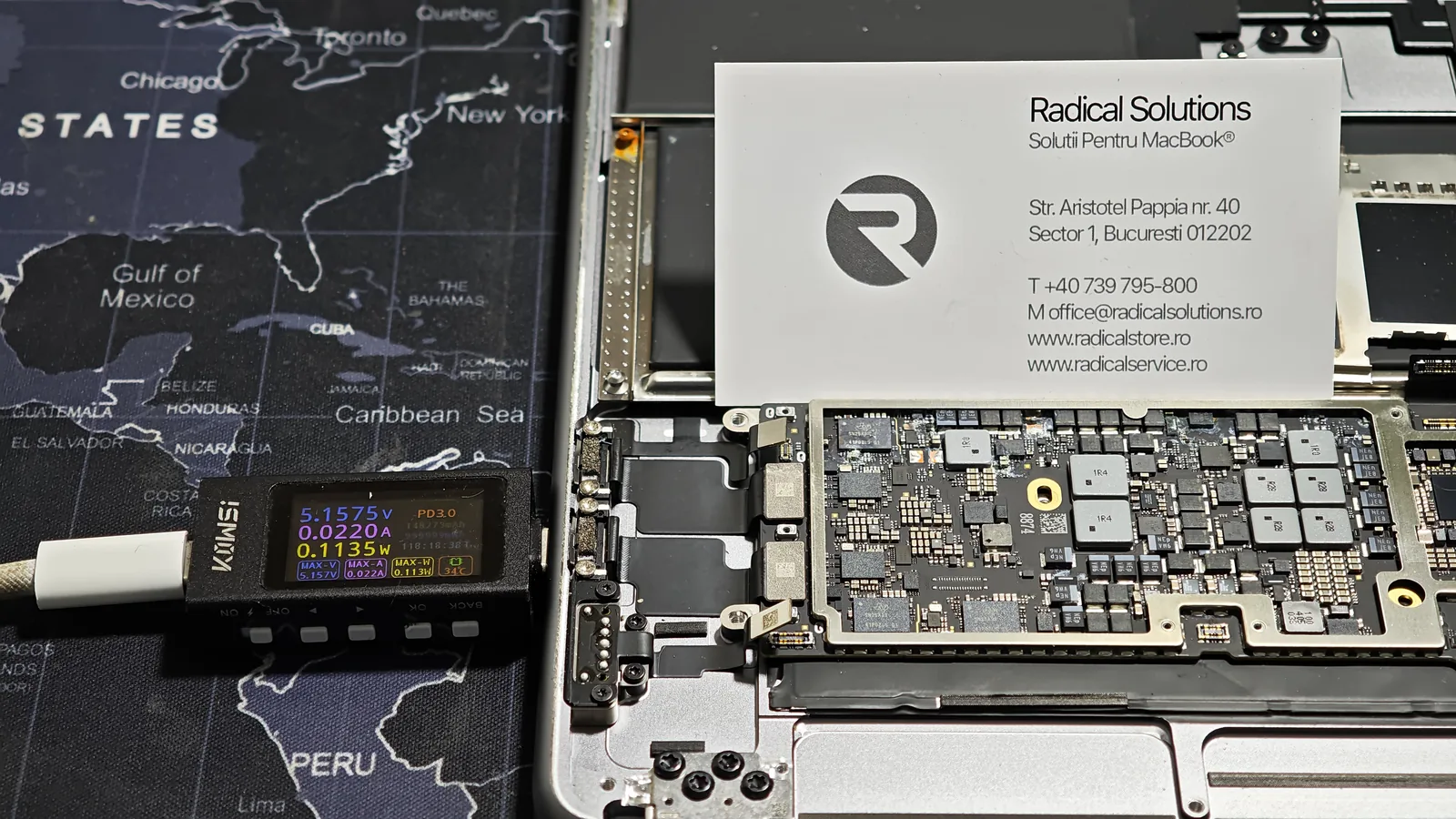 USB-C power meter showing an abnormally low draw on a MacBook with a liquid-damaged board
