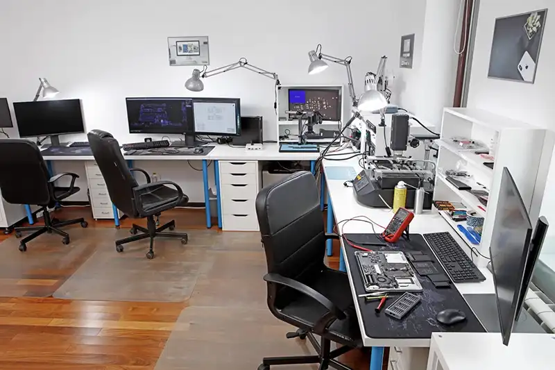 Professional Apple service equipment — microscope and soldering station at Radical Service